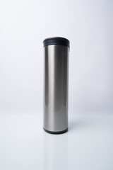 Stainless steel thermos bottle isolated on a white background