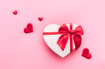 Love Valentine's Day. Love background. Gifts in the form of hearts on a pink background with the inscription love. Copy space for text. The concept of romance and love. square format. word
