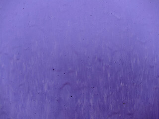 old faded background of purple paint on a wooden fence.