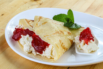 Pancake with cottage cheese and jam