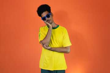 Soccer Brazilian  Fan Celebrating Isolated on Orange Background