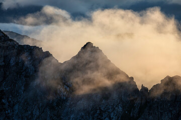 sunlight in foggy mountains