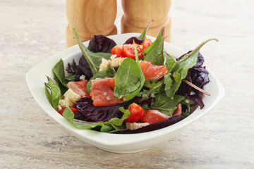 Mix salad with salmon, corn and tomato