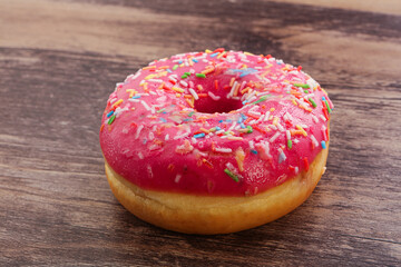 Sweet glazed struwberry donut with icing