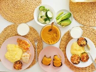 Summer breakfast with baked zucchini, mashed potatoes, zucchini caviar and cucumbers.