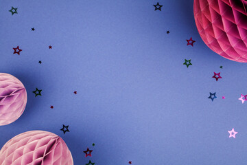 Purple Scandinavian modern paper honeycomb decoration on blue background.Concept of happiness, joy, birthday, party, advertisement, copy space 