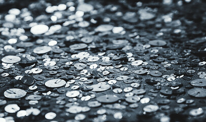 Fabric Silver texture with spangles. Background sequin. Glitter texture. Fabric sequins. Iron cloth. Sequins pattern. Abstract background. Metal structure. Dark thing. Black cloth.