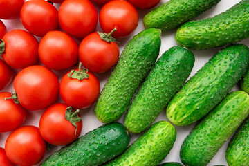 Fresh vegetables cucumbers and tomatoes on the table top view