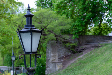 Fototapeta na wymiar A vintage lantern in a park in the City of Tallinn, Estonia