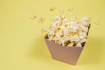 A paper bowl of salted popcorn