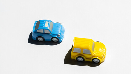 Two small children's cars. Yellow and blue
