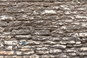 Stonewall background structure. Texture of an old Wall made of rough stondes