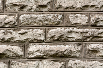 Stonewall background structure. Texture of an old Wall made of rough stondes