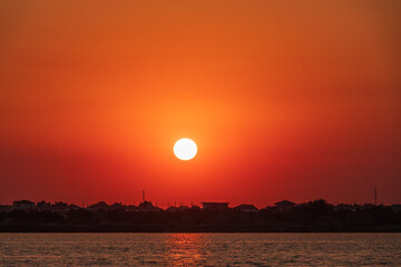 The sun goes down over a lake