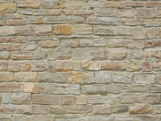 Obraz premium Facade wall with masonry of not the same rectangular bricks. Full-screen image. Not seamless texture