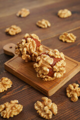 Turkish delights with plenty of hazelnut, pistachio and walnut on a wooden background