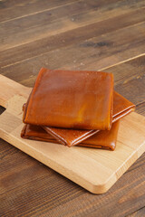 Turkish delights with plenty of hazelnut, pistachio and walnut on a wooden background