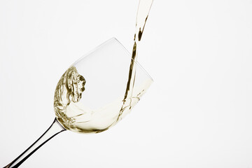 Glass of white wine with moving liquid