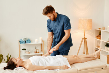 Fototapeta premium Warm toned portrait of man massaging hands of young woman in SPA session, copy space