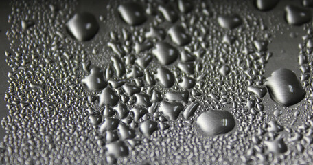 abstract drops of water on metal