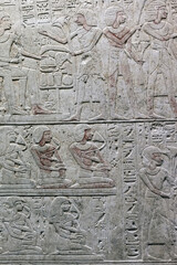 Ancient Egyptian hieroglyphs carved on sandstone - 507902715