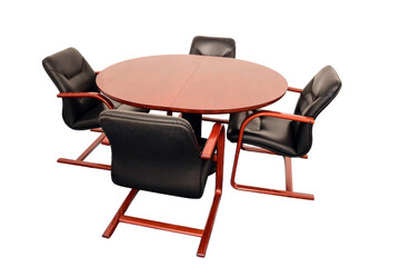 Four empty leather office chairs sit around a round table. On a white clipping background