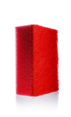 Red sponge, kitchen cleaner with abrasive surface for dish washing and cleaning isolated on white background. Housekeeping and hygiene concept.