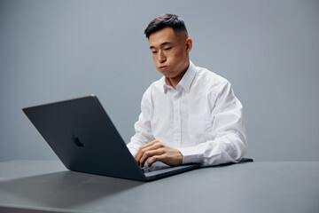 manager in a white shirt work laptop fatigue isolated background