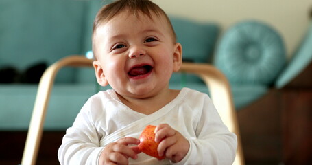 Adorable baby toddler face reaction, infant boy laughing and smiling