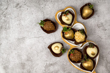 chocolate strawberries in heart shaped plates with Place for text.St Valentine's dessert concept