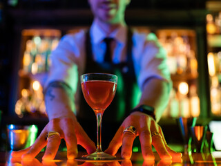 closeup of drink makes by barman