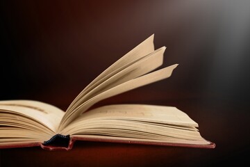 Grunge age book on the wooden desk table space. still life concept