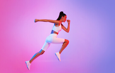 Fototapeta na wymiar Sporty Lady Running In Mid Air Over Pink Neon Background
