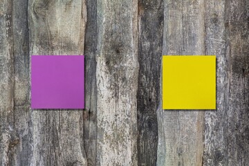 Yellow and pink note on wall with text and direction to ONLINE and ONSITE, concept of education and work in pandemic lockdow