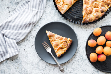 Homemade apricot tart on a grey table
