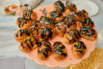 custard cakes with chocolate fondant on a tray