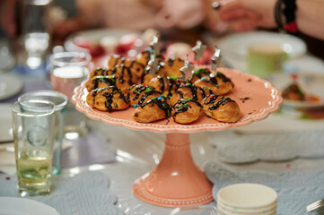 custard cakes with chocolate fondant on a tray