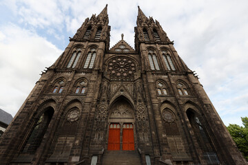 Fototapeta na wymiar Beautiful, impressive cathedral of Clermont Ferrand in France, made dark from volcanic rocks .