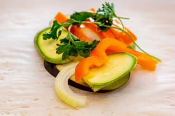 White fish fillet with vegetables in rustic style. Healthy eating: cooked fish fillet with vegetables garnish. Diet food with white fish and vegetables. Steam vegetables with roasted zander fillet