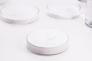 Petri dish with Benzoyl Peroxide cream, used in the preparation of cream, soap, lotion or gel in...