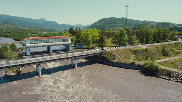 aerial view of a wide river and an old building on it. High quality 4k footage