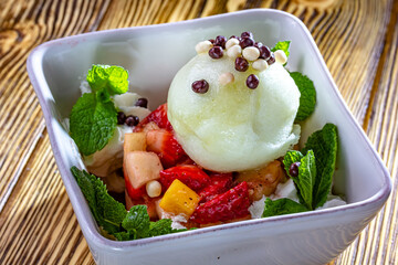 Vanilla ice cream with berries : blueberries , raspberry and strawberry