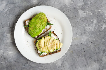 Healthy avocado toasts for breakfast or lunch with rye bread