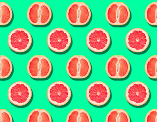 Half of tasty ripe grapefruit on white background