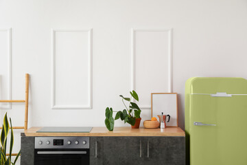 Interior of modern kitchen with stylish vintage refrigerator