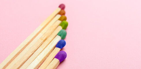 Set of rainbow matches on pink background