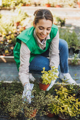 Florist Woman Gardening In Garden Center