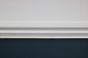Victorian design feature - dado rail painted white on white and dark teal wall - obrazy, fototapety, plakaty