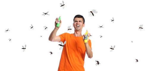 Young man with mosquito repellents on white background