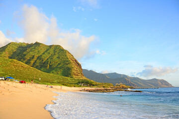 Sunset at Yokohama beach in the summer time on the west side of the island of Oahu in Hawaii at Kaena Point